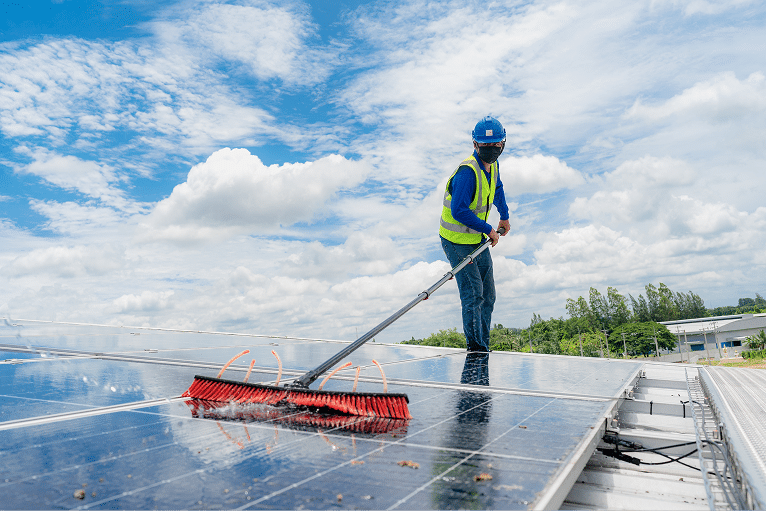 technician-cleaning-solar-panels-on-a-sunny-day-2026-03-24-22-48-58-utc 1